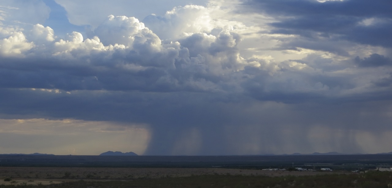 A powerful rainstorm as viewed across prairie land